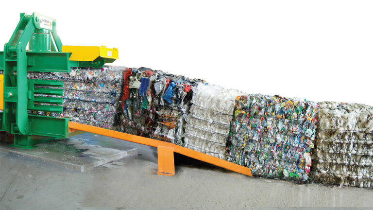 Macpresse baler producing compacted waste bales