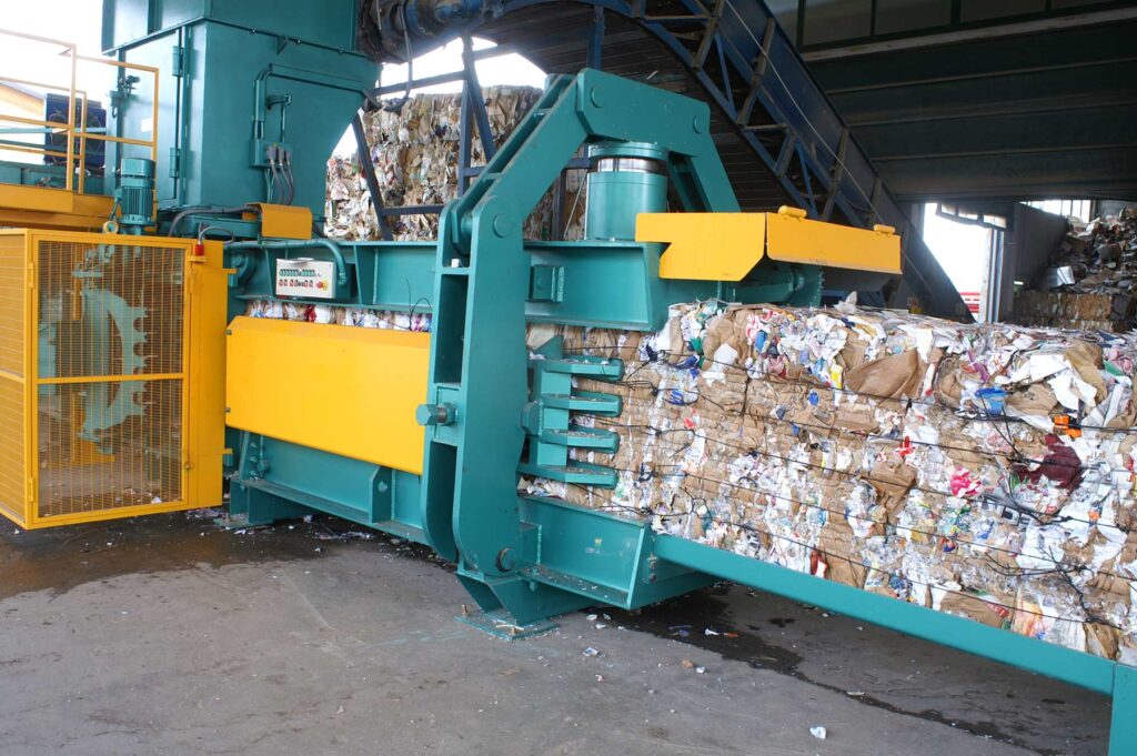 Macpresse plastic wire tying unit on RDF bale with PET wire ties