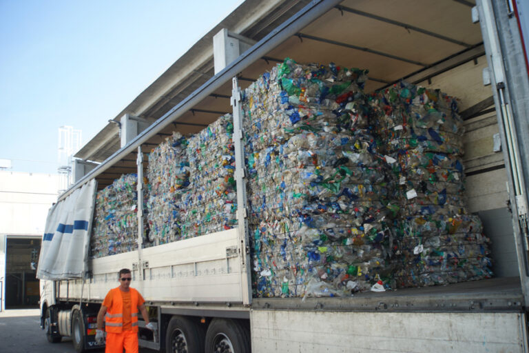 Truck loaded with baled plastic waste for SRF transport